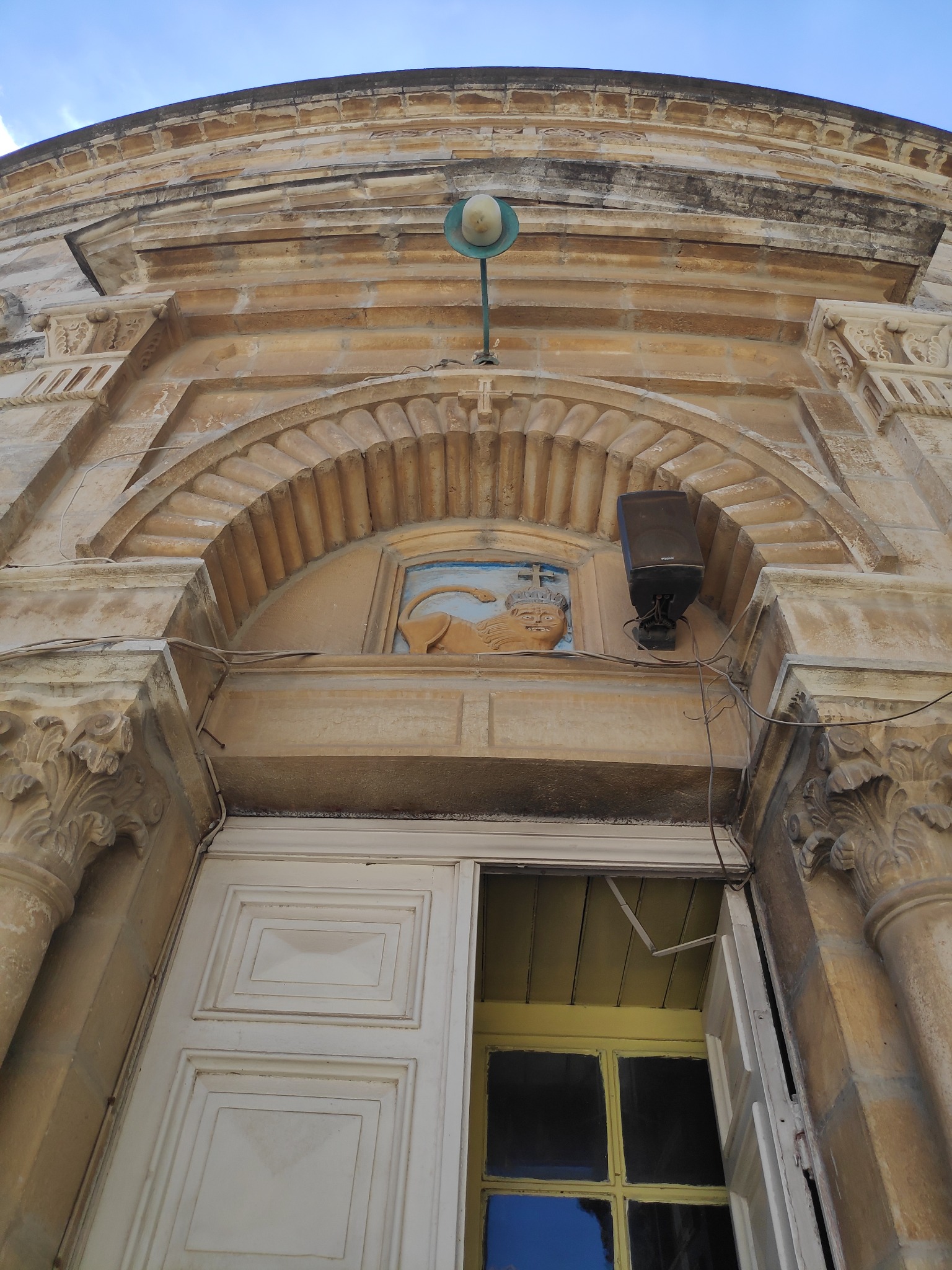 Lion emblem above church